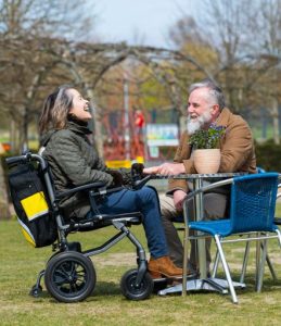 eFOLDi Lite powerchair cafe lady