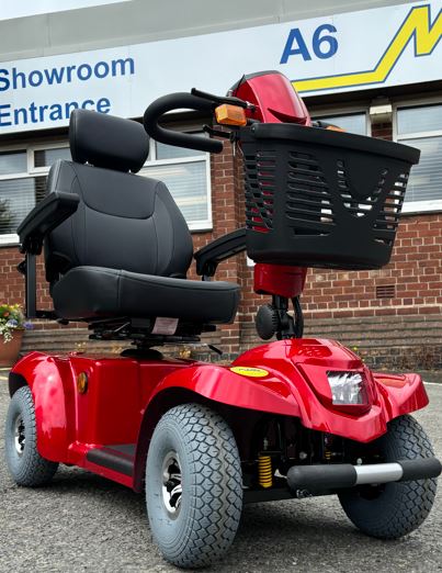 Red mobility scooter with black seat and front light