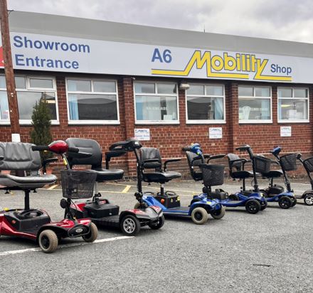 Line up of small used mobility scooters