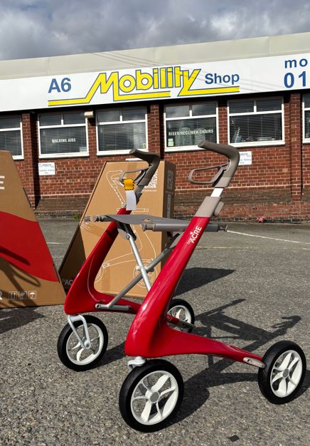 Red rollator pictured outside A6 Mobility Shop in Stockport
