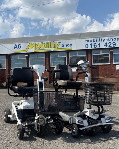2 Quingo mobility scooters with large front baskets, chrome front bumpers and black handlebars