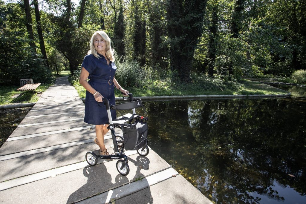 Lady with rollator walking aid