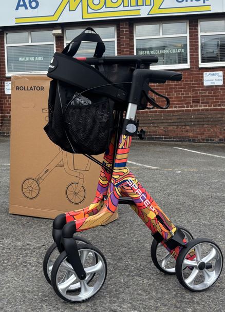 Colourful Rehasense rollator photographed outside mobility shop