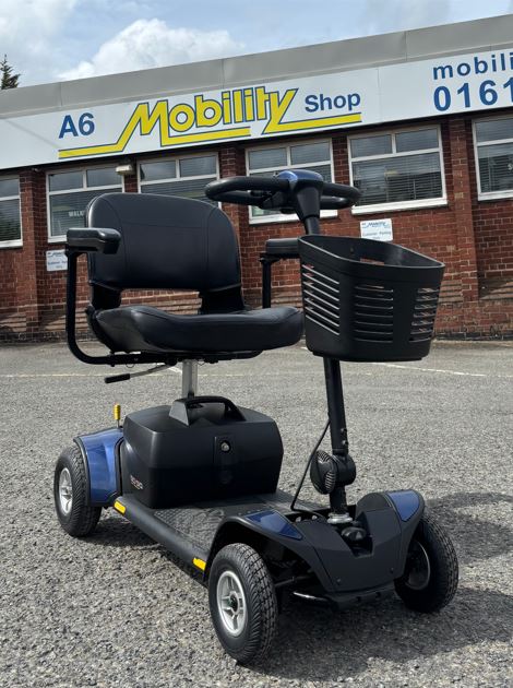 Black and blue 4 wheel Pride mobility scooter with front basket and silver wheels